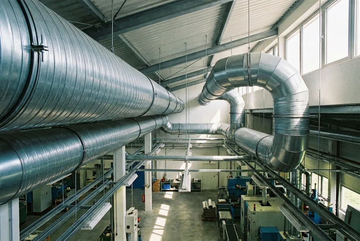 Galvanized ventilation ducting installed under a factory ceiling by HVACJakarta